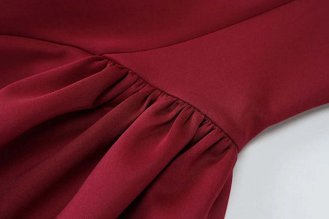 Elegant Off Shoulder Mini Dress Party detail showing the draped A-Line skirt design in rich burgundy fabric.