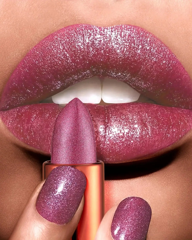 Close-up of a hand holding a purple glittery lipstick against a matching background
