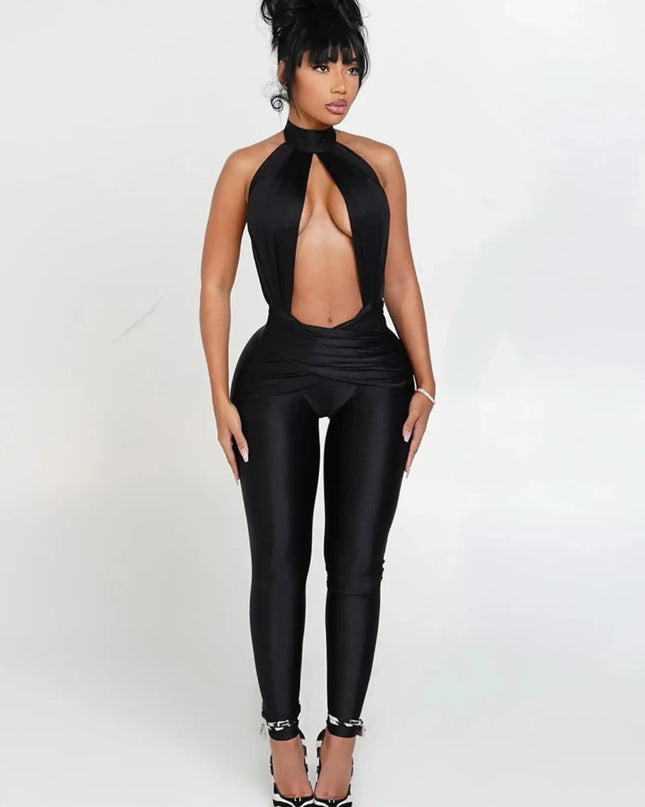 Woman wearing a black jumpsuit on a white background