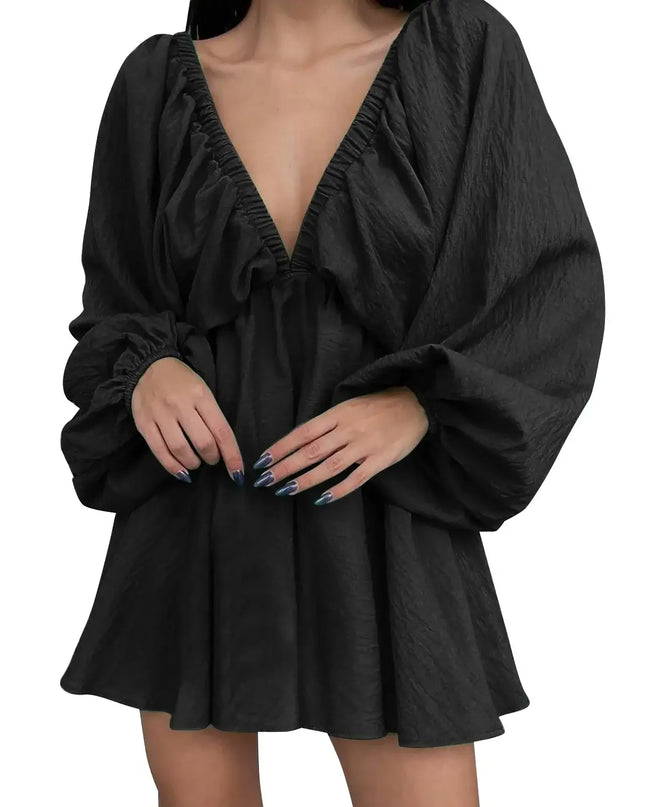 Black dress with long sleeves on a white background