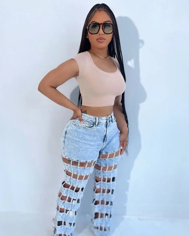 High waist hollow out denim pants styled with a fitted crop top and sunglasses for a chic Y2K streetwear look.