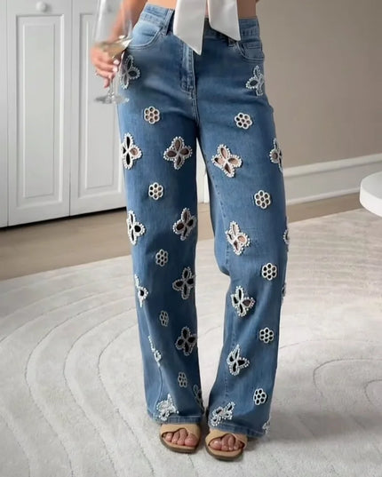 Casual hollow out women’s jeans with floral designs and a loose straight fit, perfect for a trendy urban look.