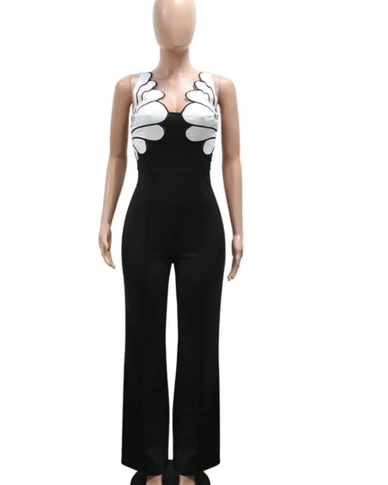 Mannequin wearing a black jumpsuit with white floral patterns on a white background