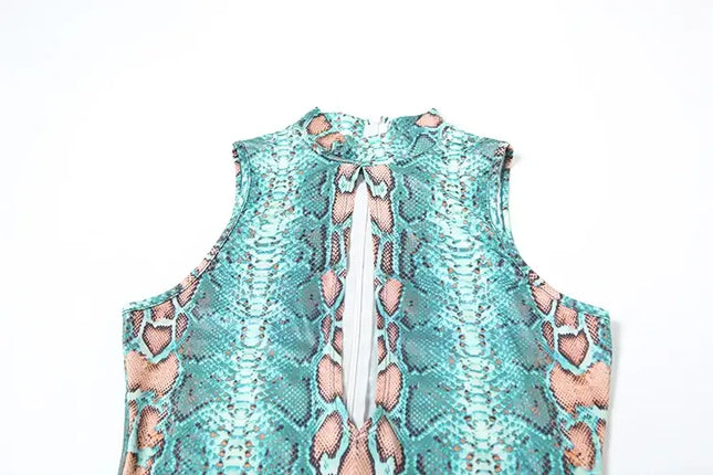 Teal lace top with cut-out design on a white background