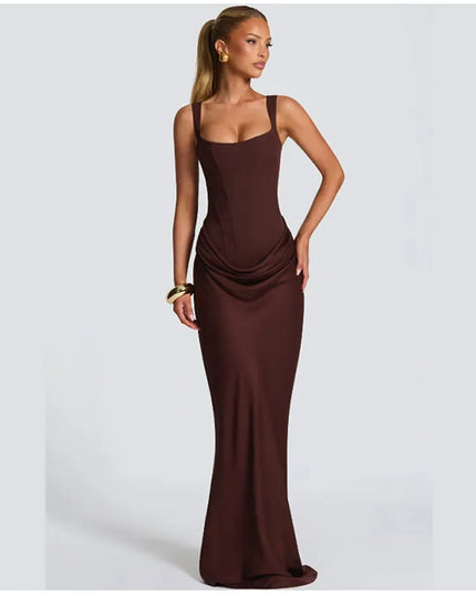 Brown pleated maxi dress square neck sleeveless gown on model, showcasing its elegant silhouette and flowing fit.