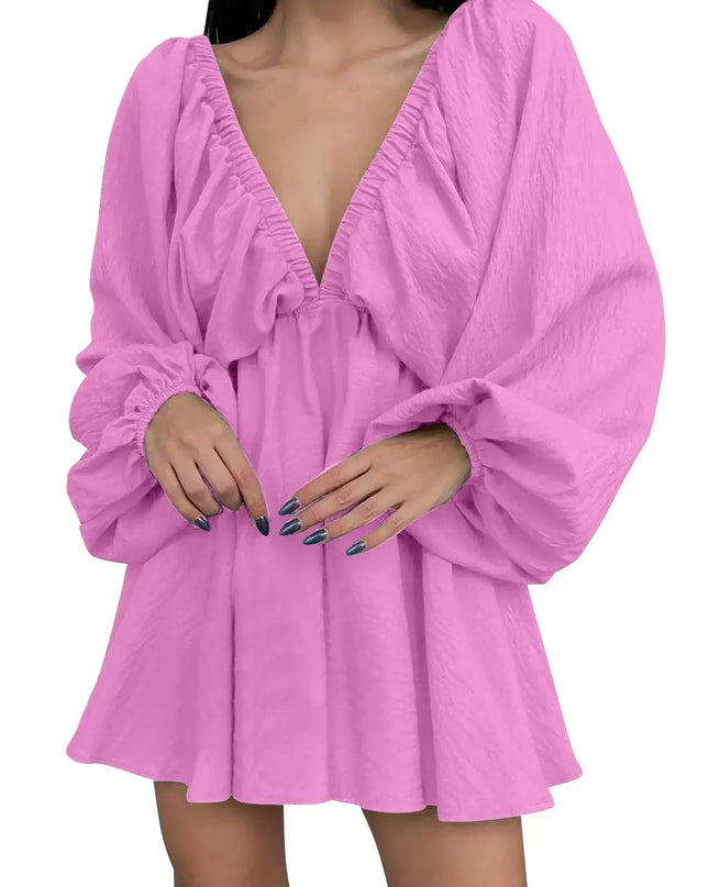 Pink dress with long sleeves on a white background