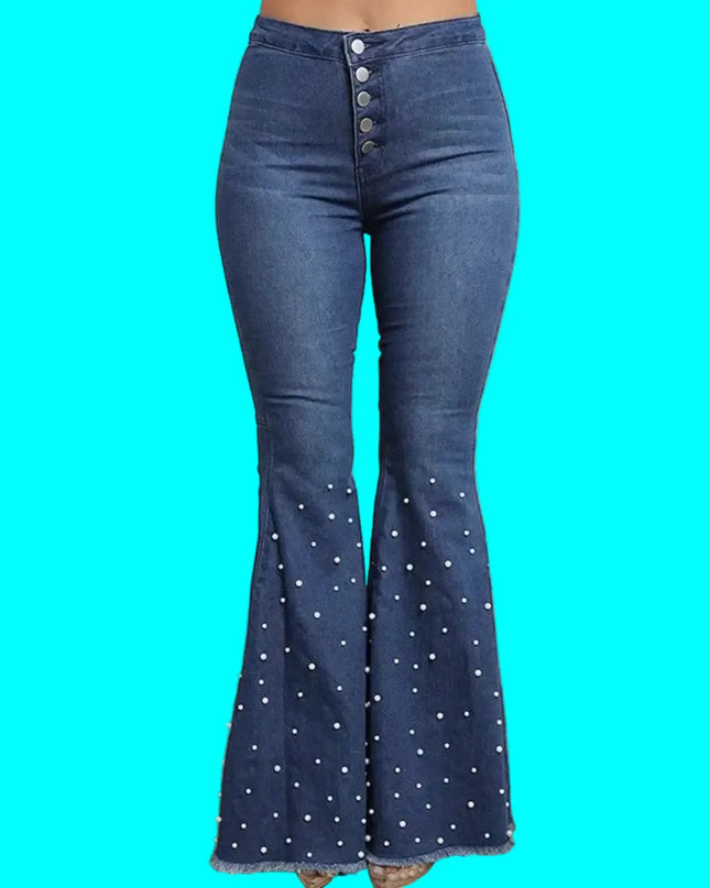Blue denim bell-bottom pants with decorative buttons on a turquoise background