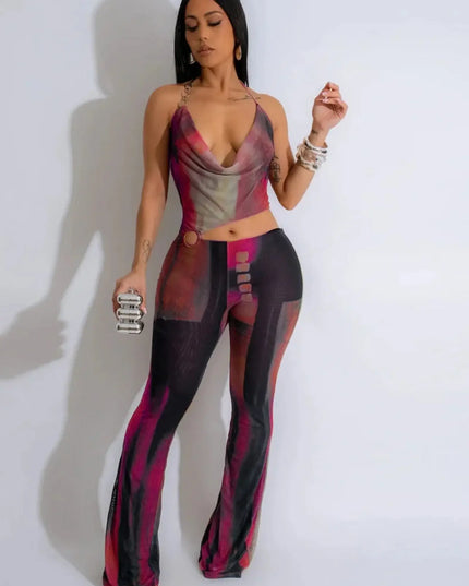 Woman wearing a colorful outfit with a patterned top and pants on a white background