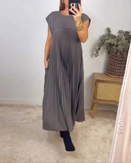 women's elegant sleeveless dress with pockets in grey, featuring pleats and a flowy design, perfect for casual outings.