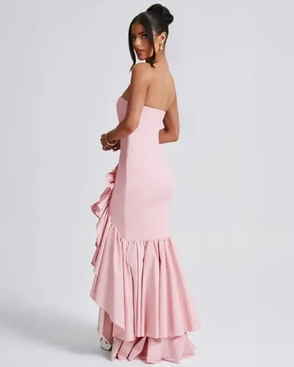 Sexy strapless summer dress in pink with a ruffled hem, showcasing a stylish back view.