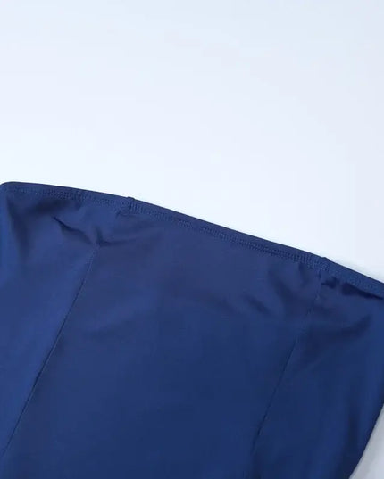 Detail of the sexy strapless summer dress showcasing its elegant neckline and smooth fabric texture.