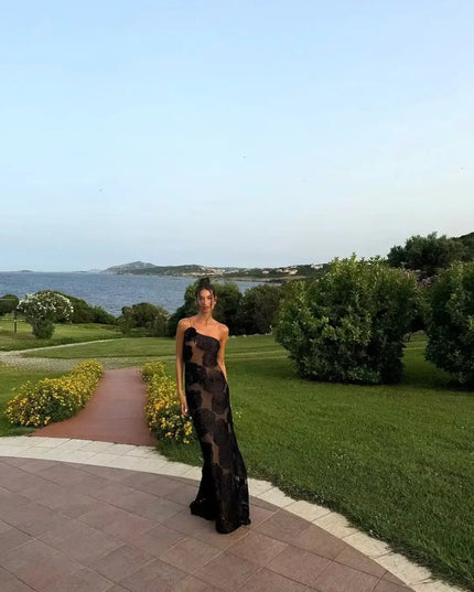 Oligai one shoulder elegant dress perfect for outdoor weddings and parties by the sea in a stunning landscape.