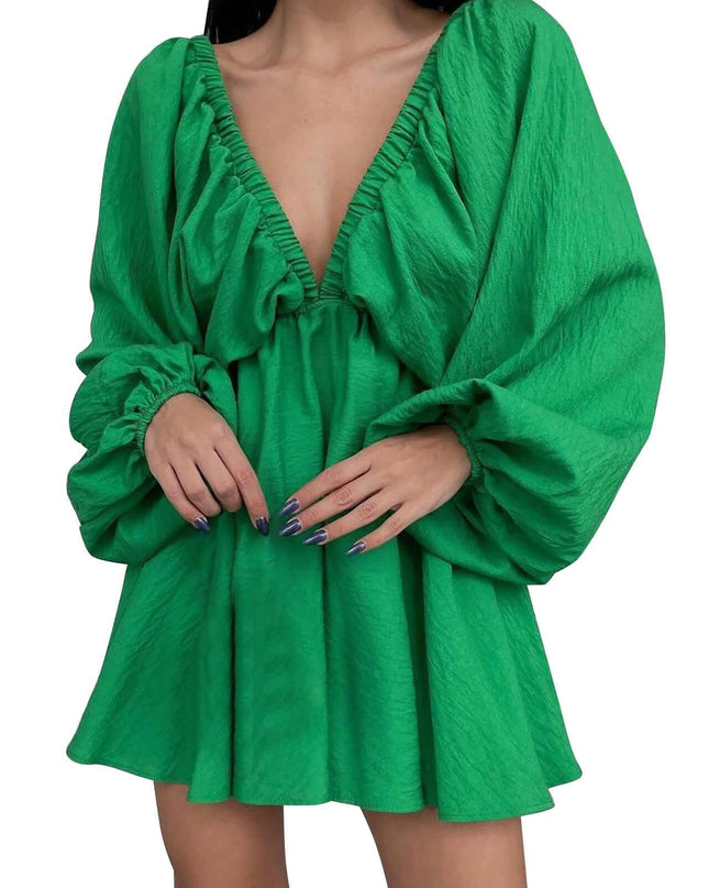 Green dress with long sleeves on a white background
