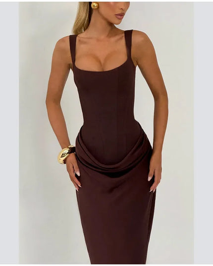 Model wearing a brown pleated maxi dress showcasing its square neck and sleeveless design.