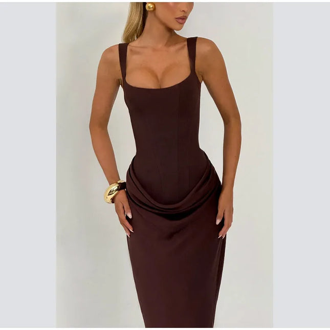 Model wearing a brown pleated maxi dress showcasing its square neck and sleeveless design.