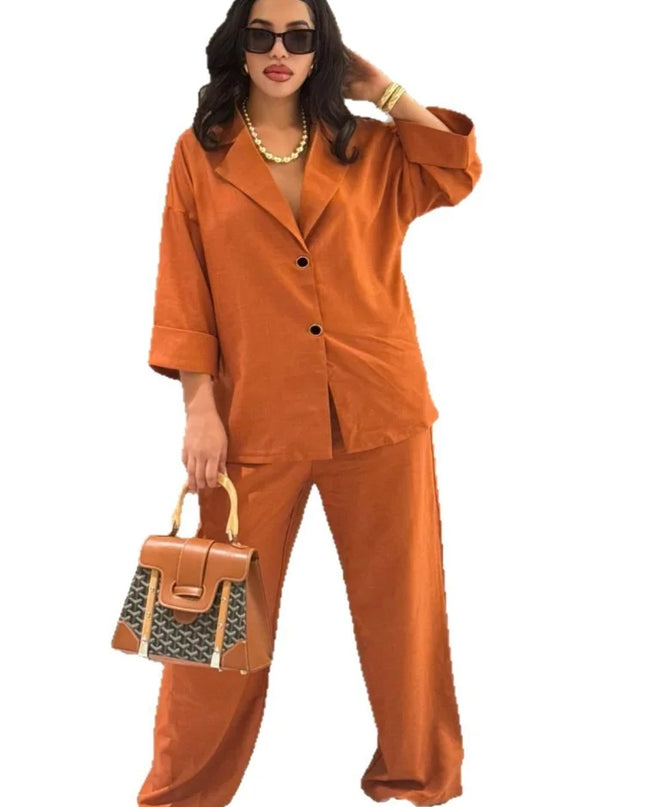 Womens casual suit featuring an orange lapel shirt and high waist straight pants, styled with a chic handbag.