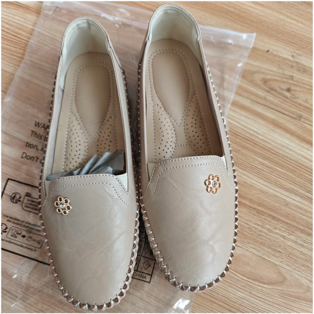 comfortable women's loafers with laser stitch detail in beige, flat slip-on shoes for casual streetwear.