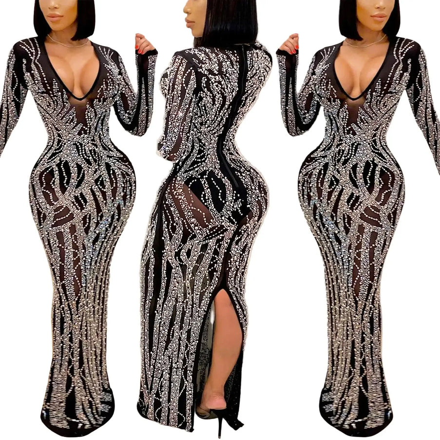 Black and silver patterned dress with a high slit on a neutral background