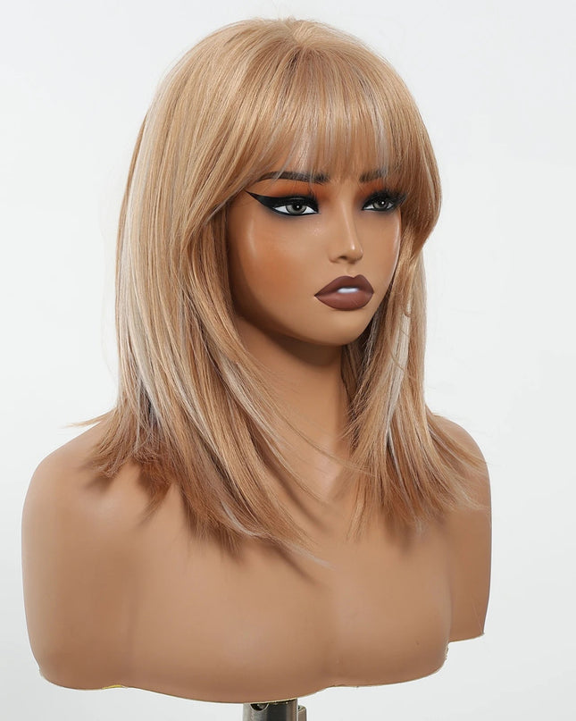 Blonde wig with bangs on a mannequin head against a white background