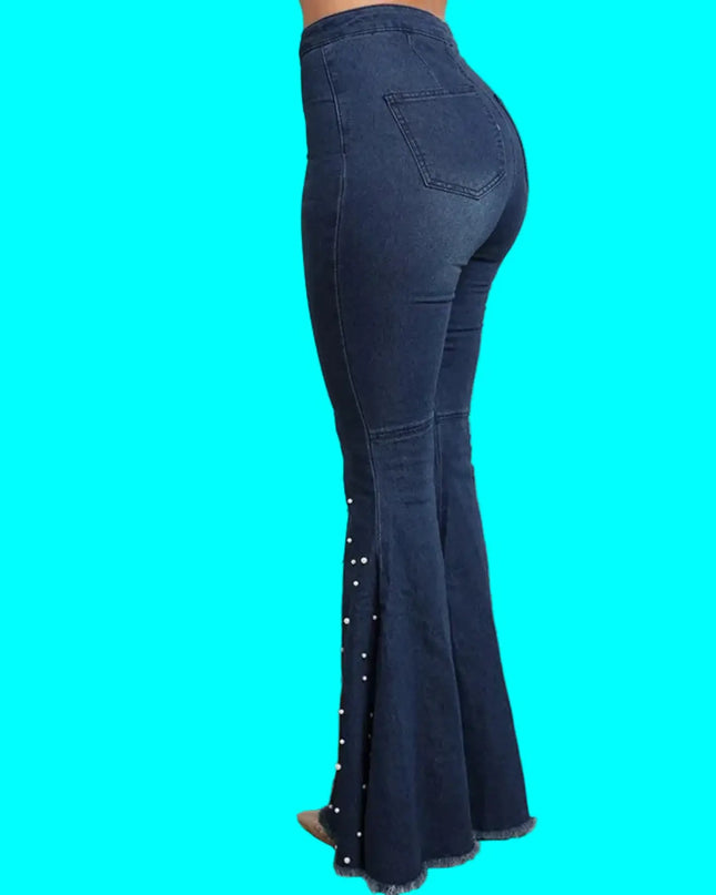 Blue flared jeans with decorative elements on a turquoise background