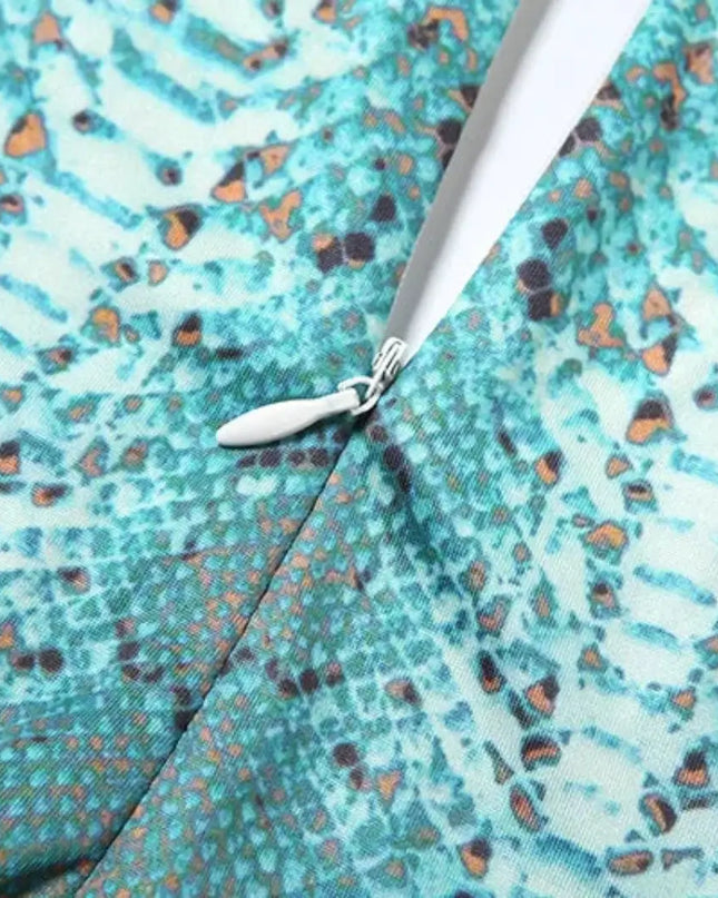 Close-up of a patterned fabric with a zipper running through it.