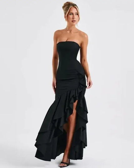 Sexy strapless summer dress featuring a sleek design and ruffled asymmetrical hem for a chic look.