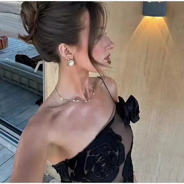 Oligai one shoulder elegant dress showcased by a woman, featuring a sexy mesh design and floral detailing, perfect for special occasions.