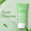 Matcha peeling gel tube with green leaves on a light green background