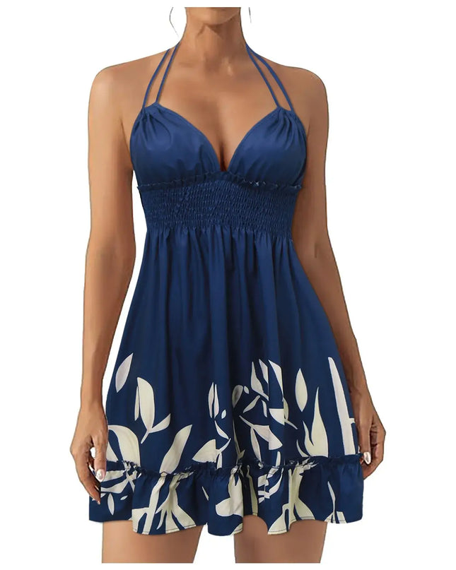 Trendy navy blue summer dress for women, featuring floral designs and a halter neckline, perfect for warm weather.