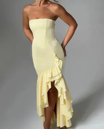 Sexy strapless summer dress in yellow with ruffled hem and bold silhouette, perfect for spring and summer fashion.