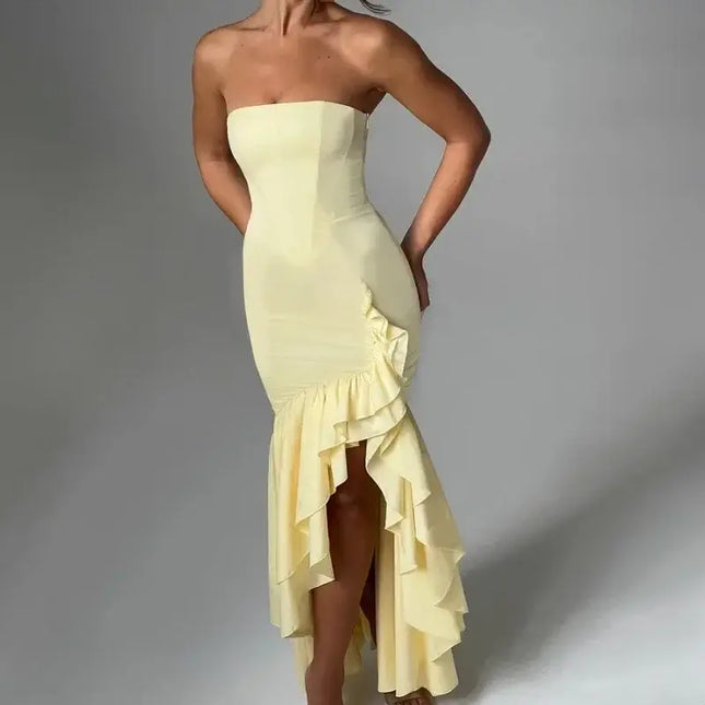 Sexy strapless summer dress in yellow with ruffled hem and bold silhouette, perfect for spring and summer fashion.