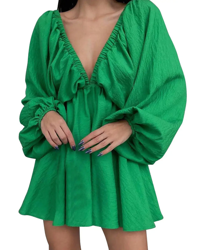 Green dress with long sleeves on a white background