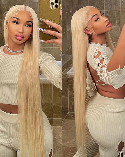 Woman taking a mirror selfie wearing a white outfit with cut-out details.