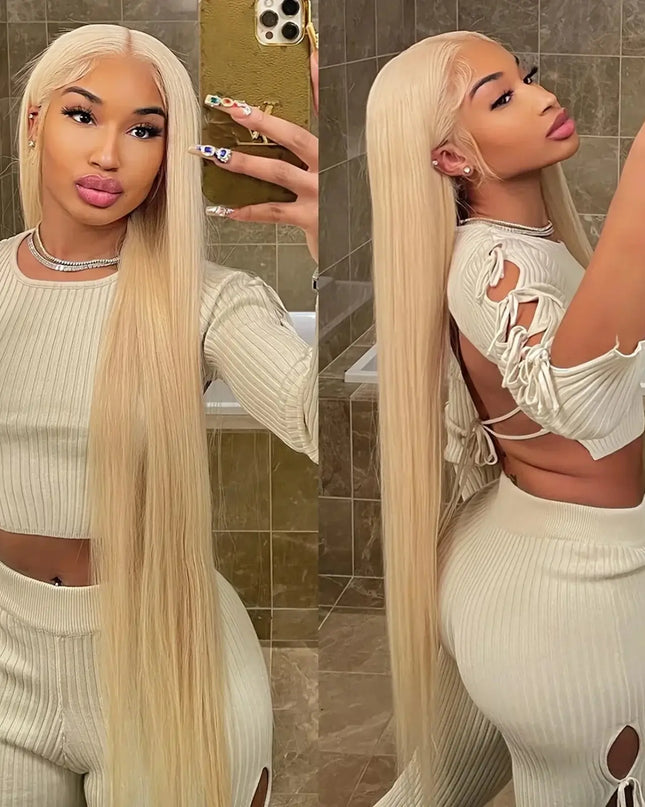 Woman taking a mirror selfie wearing a white outfit with cut-out details.