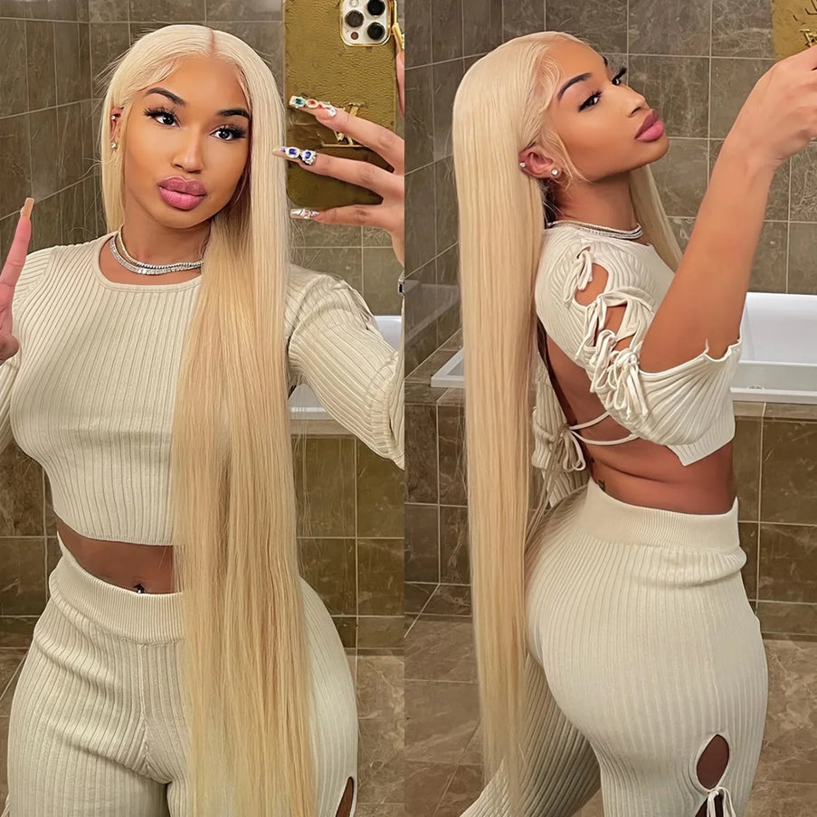 Woman taking a mirror selfie wearing a white outfit with cut-out details.