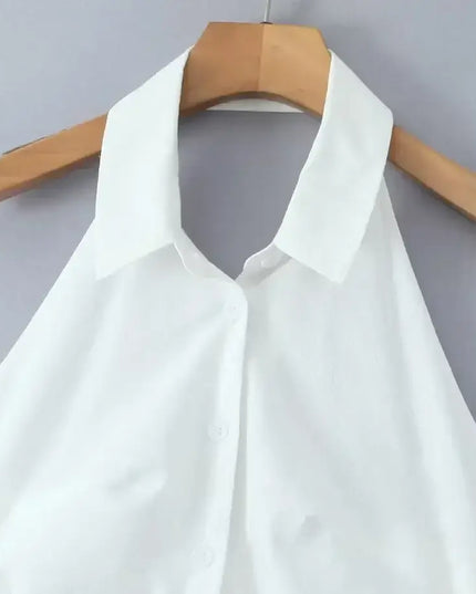 Close-up of the turn down collar on a white cotton linen summer dress for women.