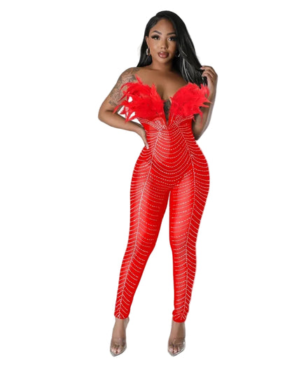 Woman wearing a red jumpsuit with a geometric pattern on a gray background