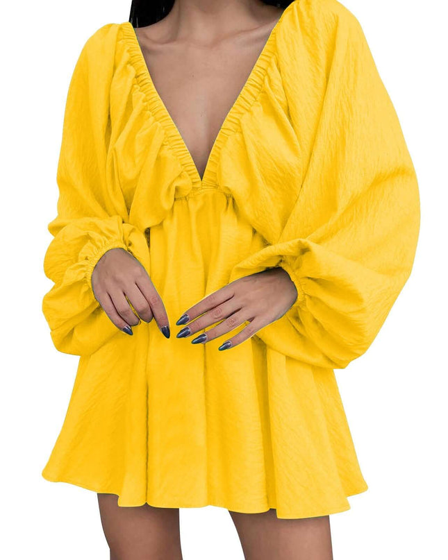 Yellow dress with long sleeves on a white background