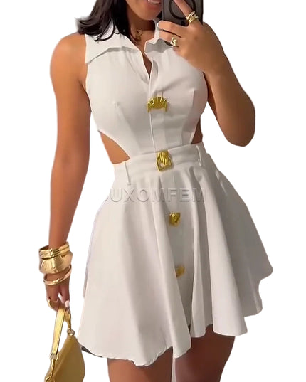 Woman wearing a white dress with gold buttons and accessories, holding a yellow handbag.