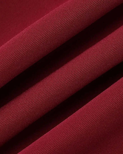 close-up of luxurious burgundy fabric showcasing smooth, elegant texture for off shoulder mini dress party.