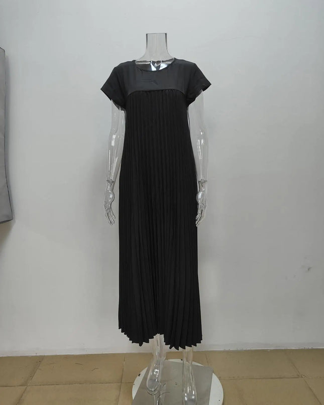 Women's elegant sleeveless dress with pockets in black, featuring pleated design, displayed on a mannequin.