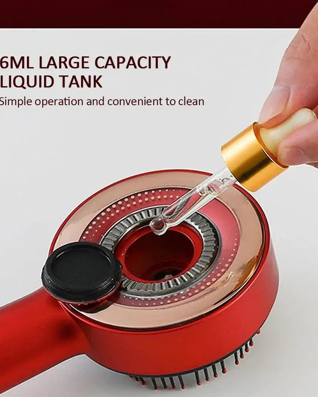 Close-up of a red vibration massage comb showing the 6ml liquid tank for easy oil application and cleaning.