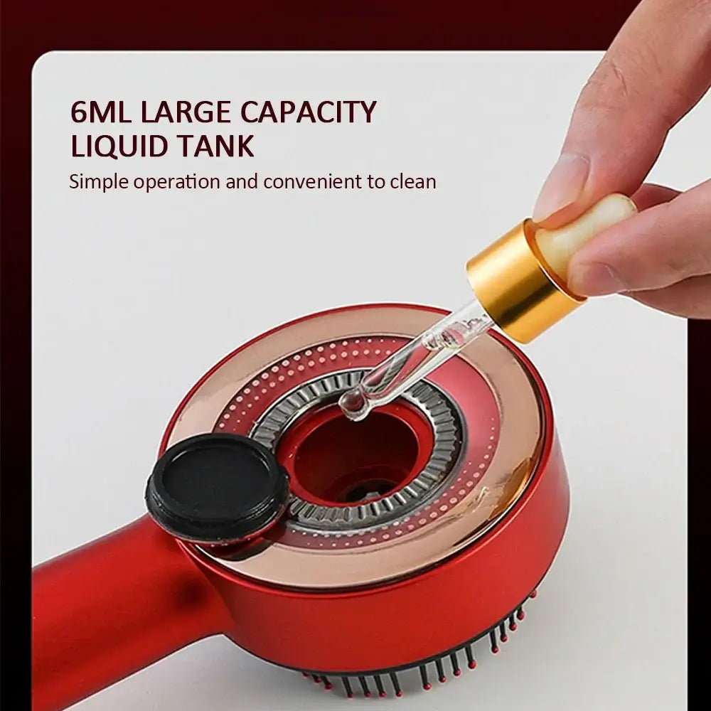 Close-up of a red vibration massage comb showing the 6ml liquid tank for easy oil application and cleaning.