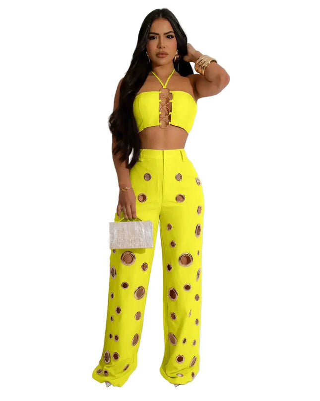 Woman wearing a bright yellow outfit with brown buttons on a white background