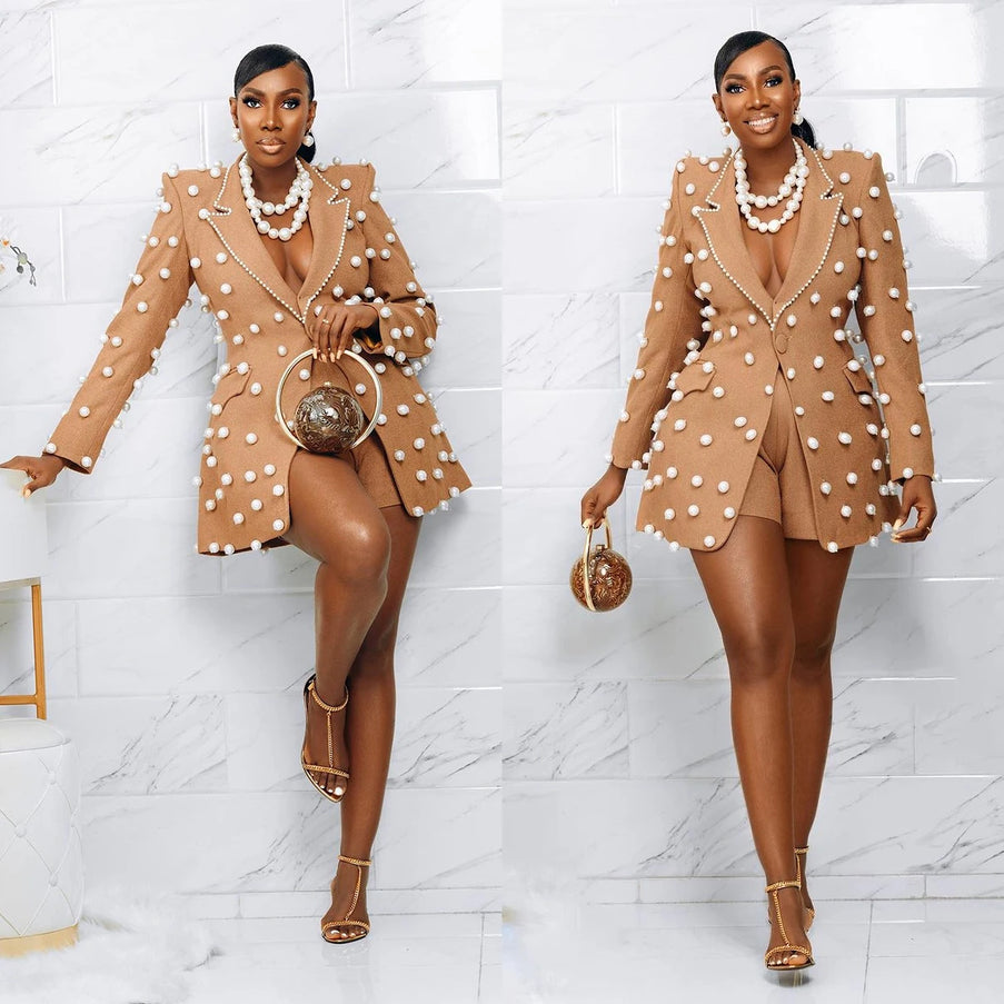 Luxury women's blazer suit featuring pearl embellishments, elegant design, and chic formal wear style.