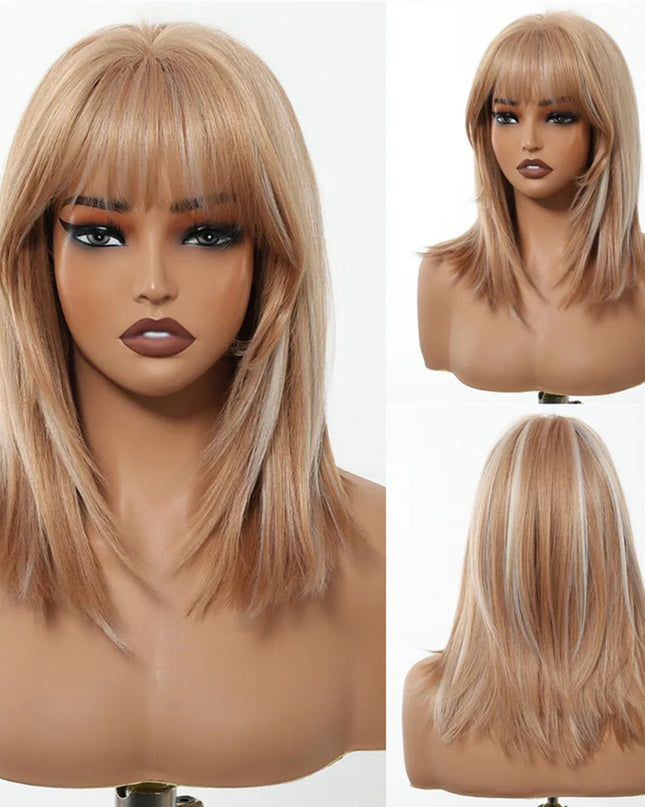 Blonde wig with bangs on a mannequin head against a white background