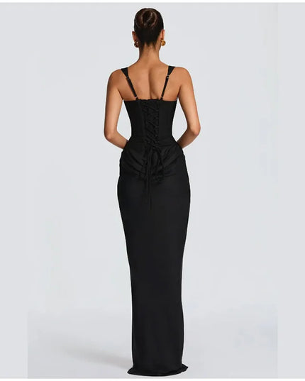 Back view of a woman wearing a form-fitting black gown with lace-up details, showcasing elegance and style.