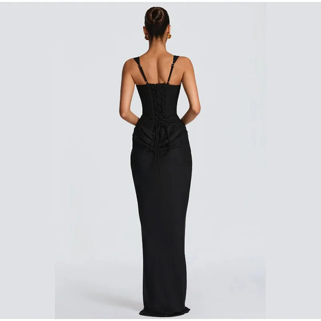 Back view of a woman wearing a form-fitting black gown with lace-up details, showcasing elegance and style.