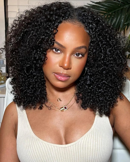 Woman wearing a Jerry Curly V Part Wig with a natural black curly hairstyle and stylish jewelry.