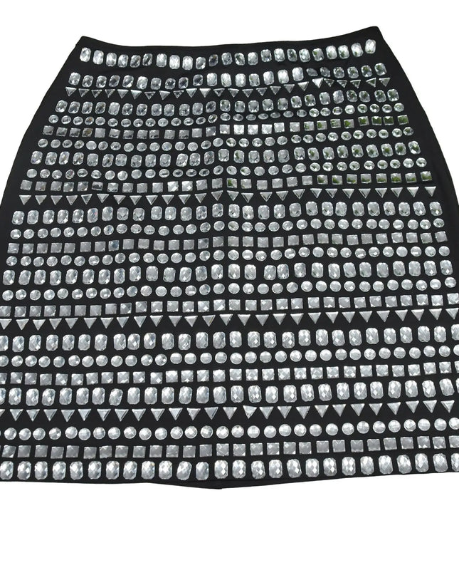 Black skirt with silver studs on a white background